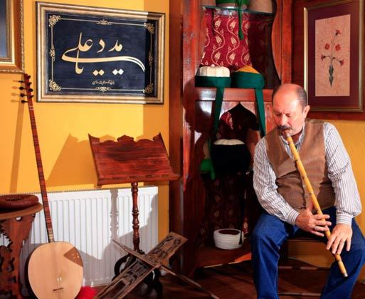 Ney artist and craftsman Salih Bilgin playing the ney at his Istanbul workshop