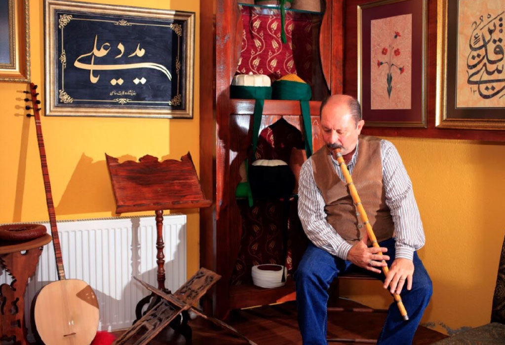 Ney artist and craftsman Salih Bilgin playing the ney at his Istanbul workshop. Photo by Salih Bilgin. Courtesy of the Endangered Material Knowledge Programme.